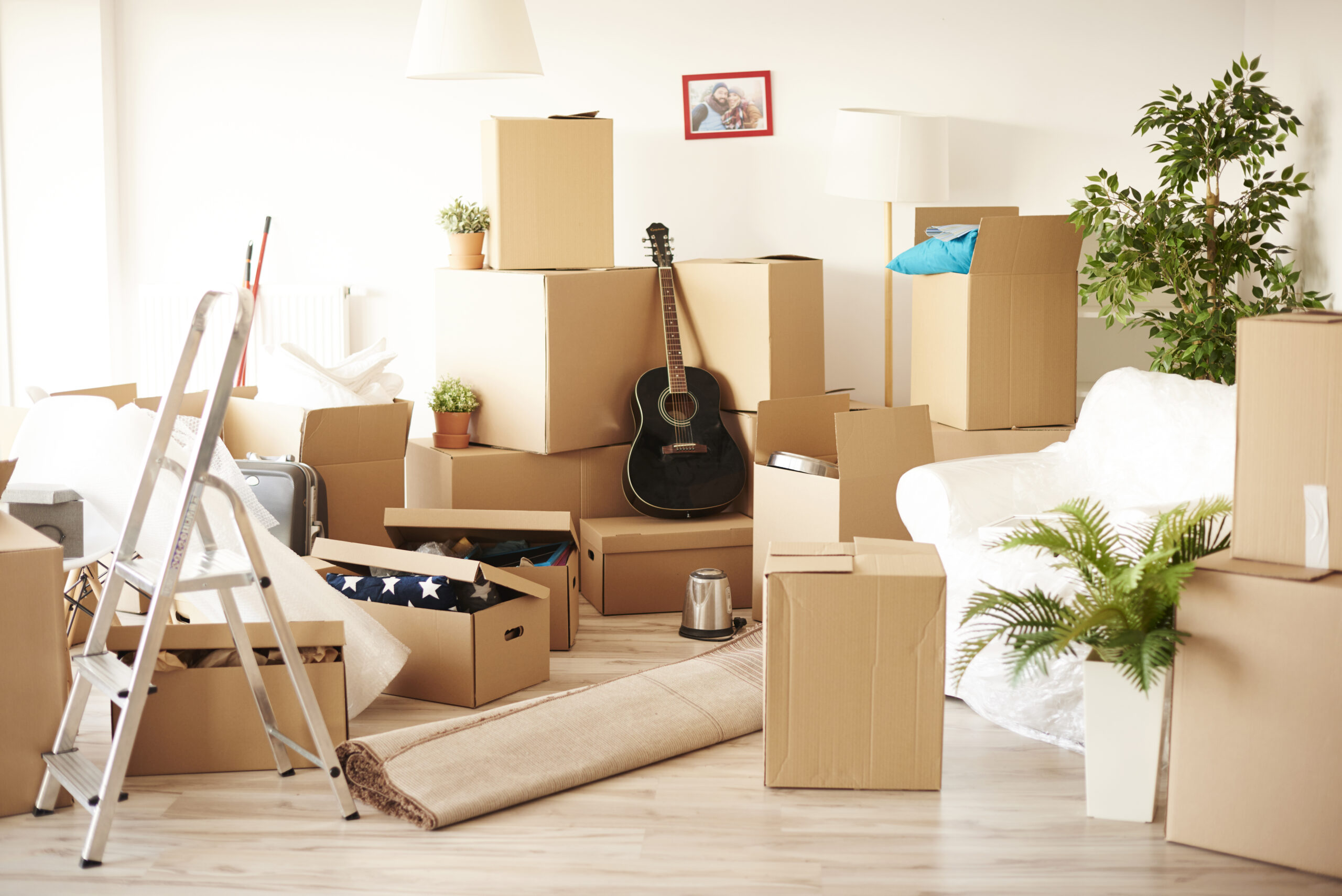 top view of messy and full of moving boxes room